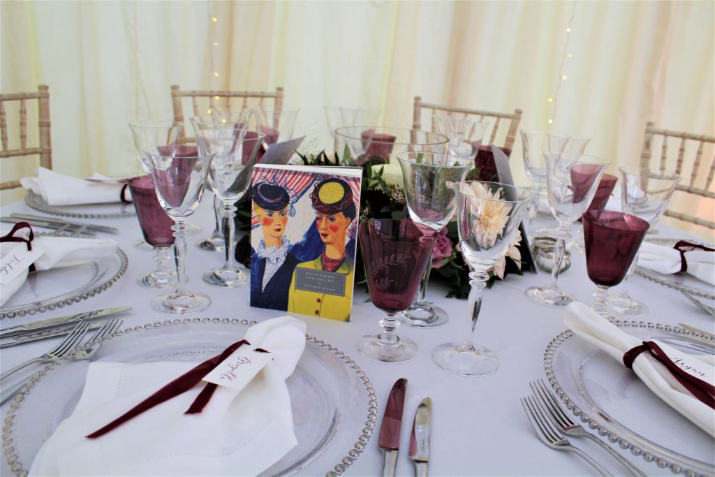 marquee wedding table naming using books