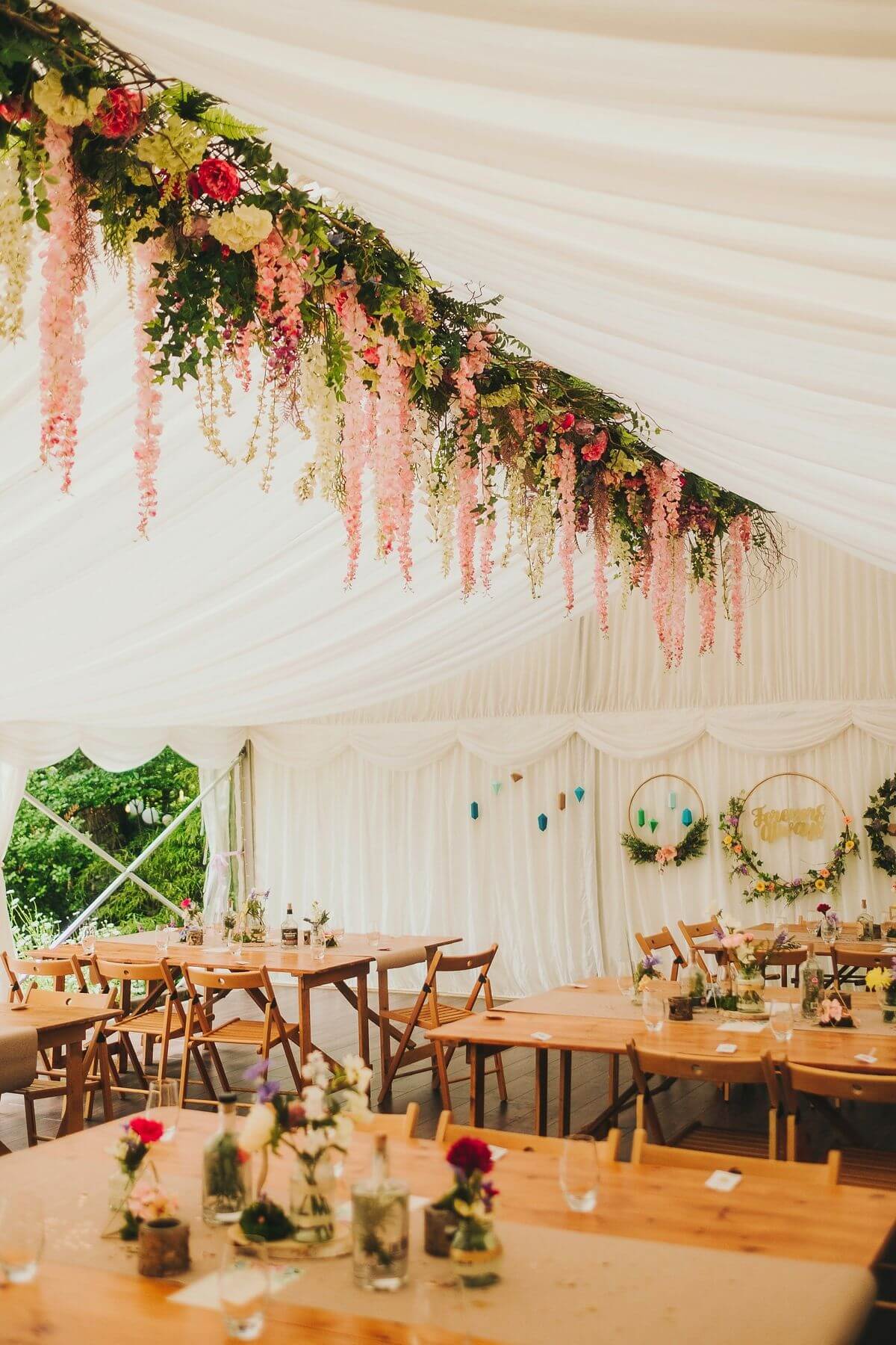 Floral hanging installation in wedding marquee for marquee decoration