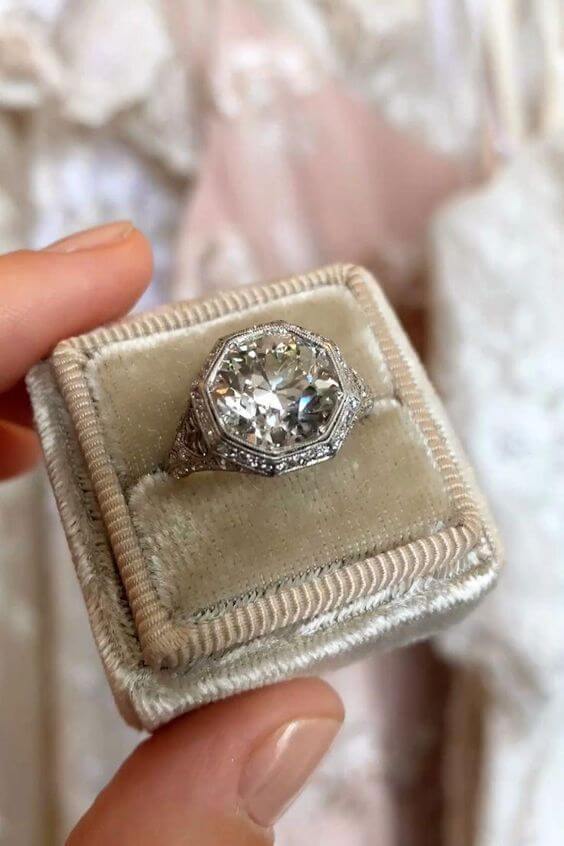 Engagement ring in velvet box.