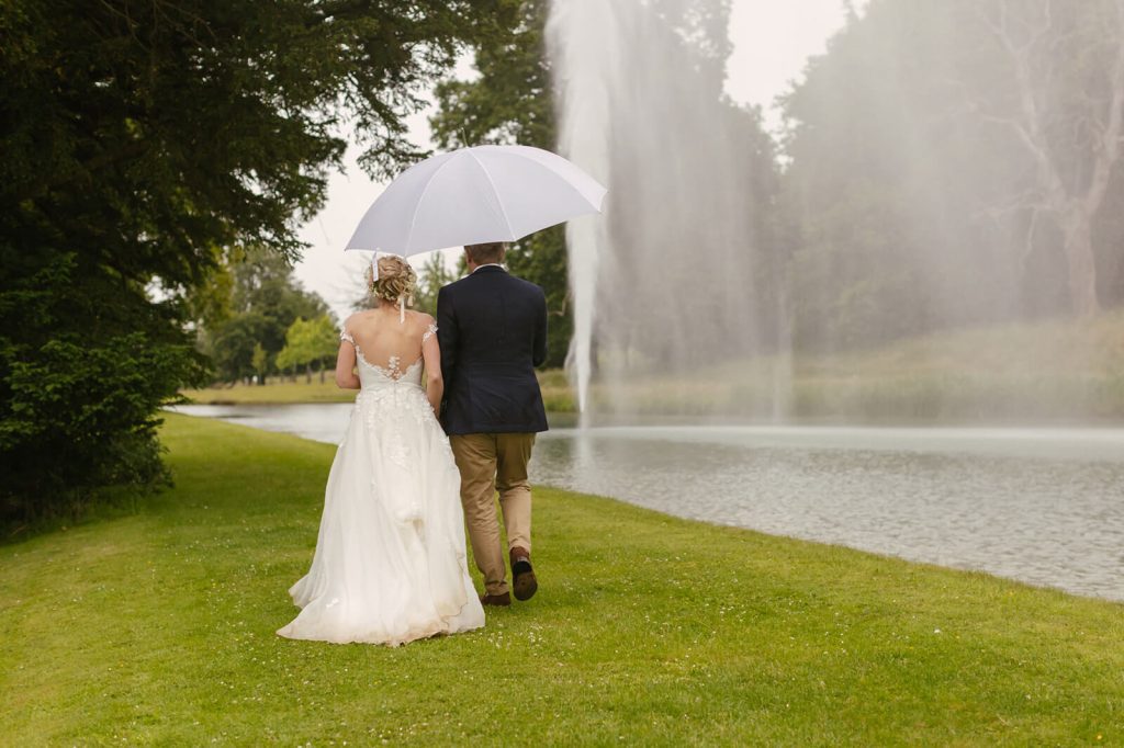 Stanwahy House Wedding Couple Walking beside fountain