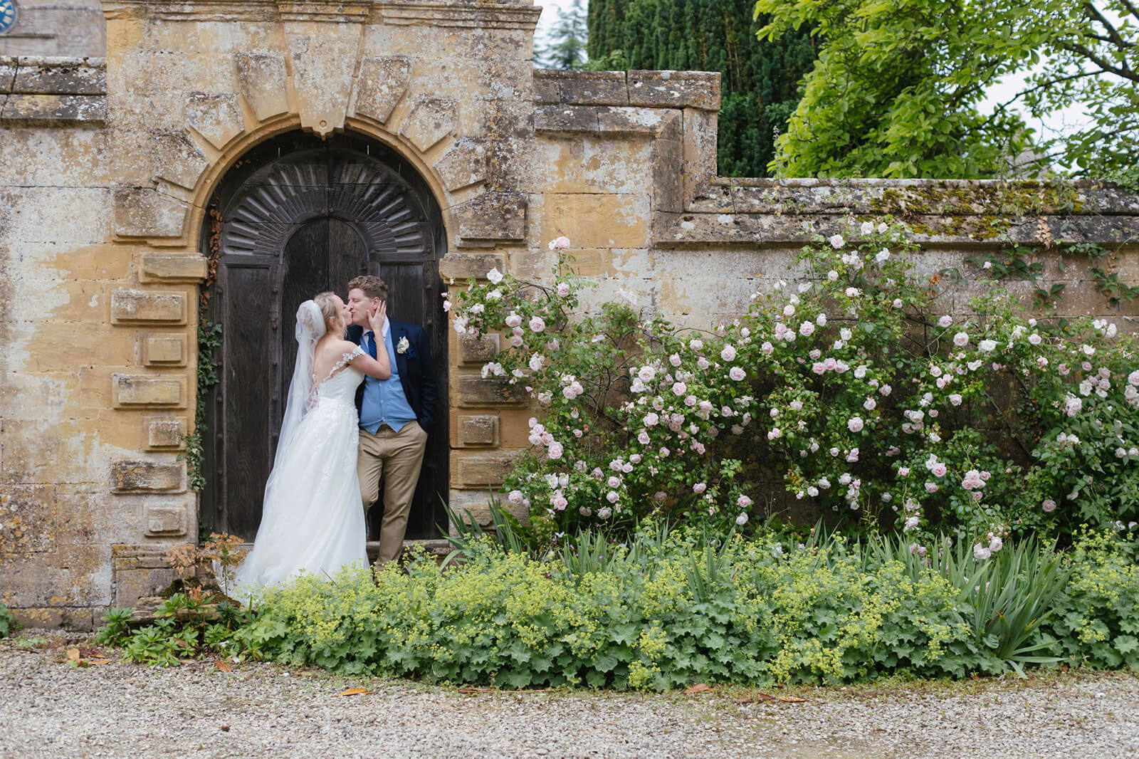 Stanway House Wedding Couple Kissing Walled Garden