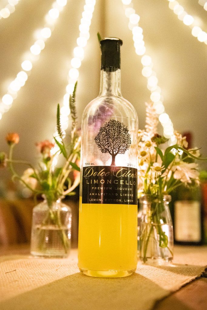 wedding colour scheme table setting with limoncello bottle