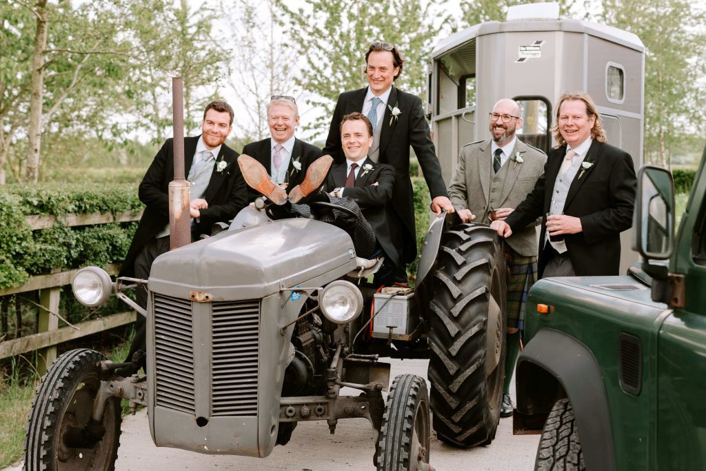 Bestmen Groomsmen on a vintage tractor