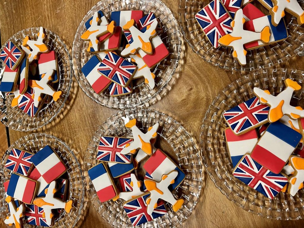 Union Jack, French flag and airplane-shaped iced biscuits celebrating the couple’s Paris love story