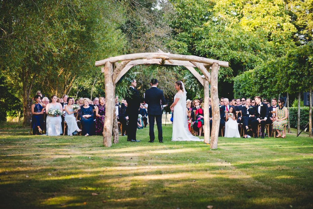 uk wedding laws garden wedding by uk wedding planner under wooden arch