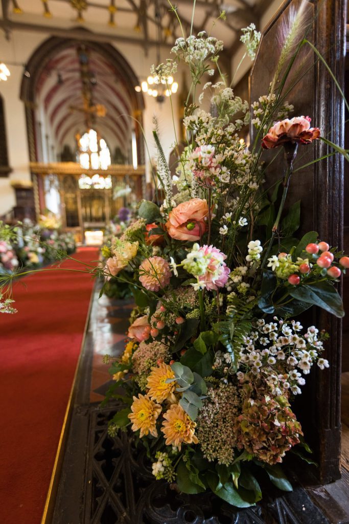 Autumnal flowers lining the aisle Knightsbridge The Berkeley London city wedding
