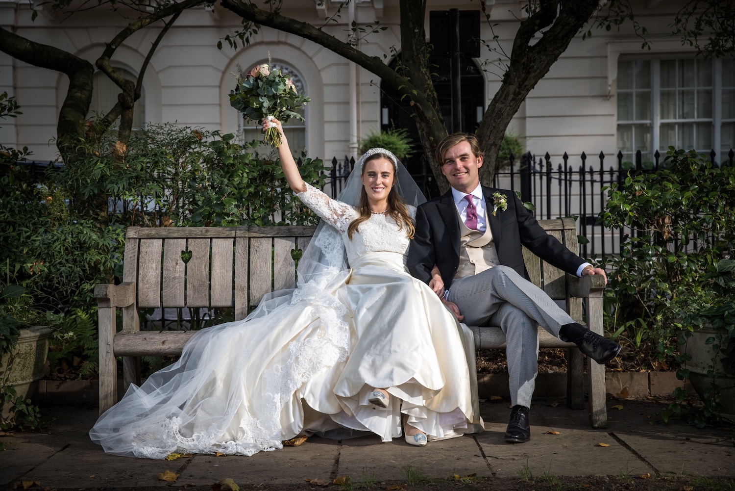 London City Wedding Bride and Groom sitting on a bench