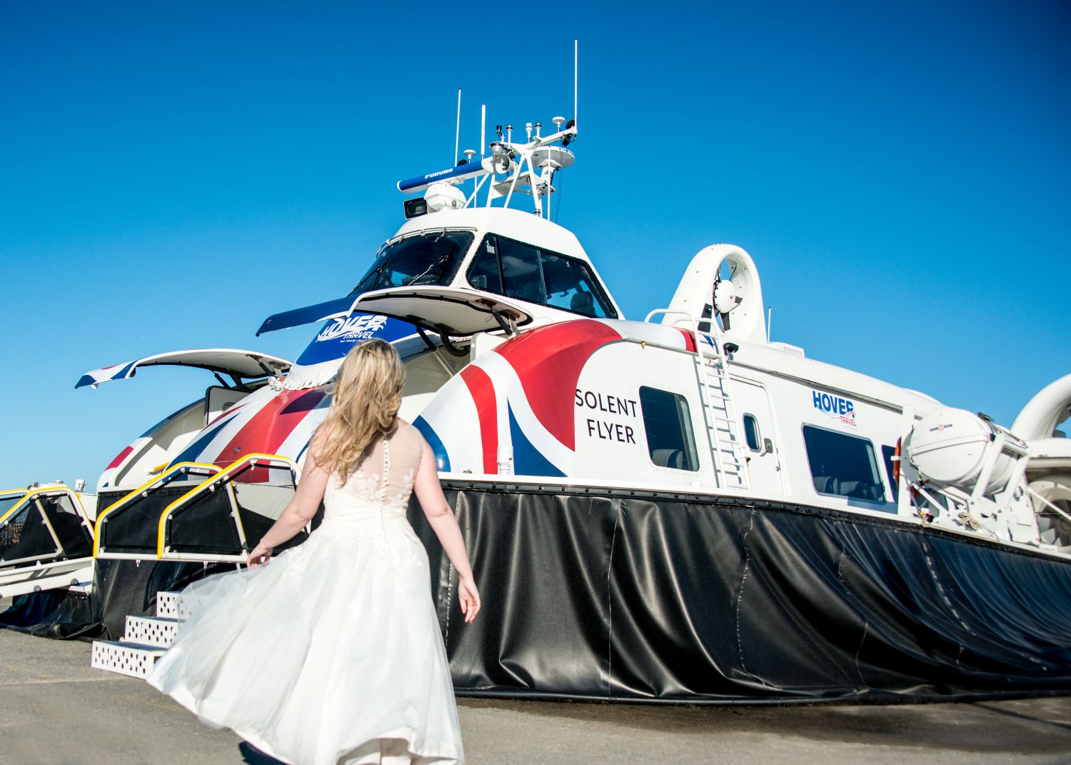 Priory Bay Wedding Bride approaching hovercraft to board bride boarding Hovercraft Isle of Wight wedding
