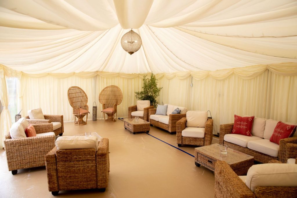 comfy seating inside wedding marquee