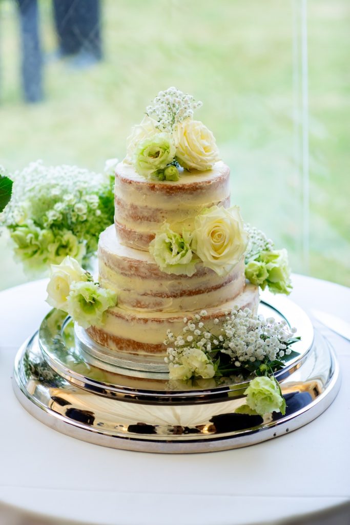 semi naked wedding cake for marquee wedding at home in wiltshire
